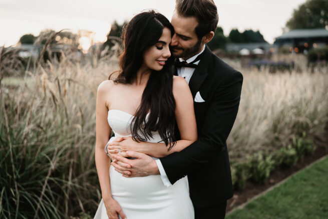 KZN wedding photographer captures Moritz adjusting his suit before the ceremony